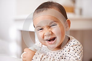 Baby, toddler portrait and laugh in home, childhood and smile for enjoyment or fun in bedroom. Girl, kid and happy for
