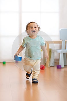 Baby toddler running indoors