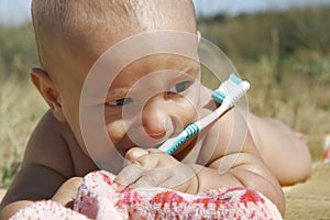 Baby with toothbrush