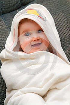 Baby in towel after bath