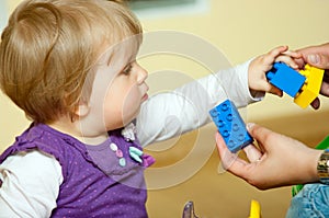 Baby with toy blocks