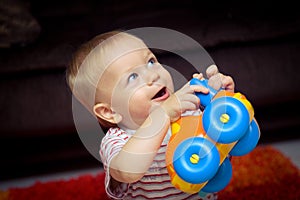 Baby with toy car