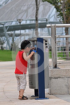 Baby and trash can