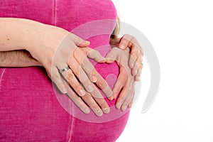 Baby tummy with parenets hands