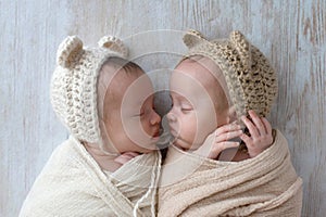 Baby Twin Girls Wearing Bear Bonnets