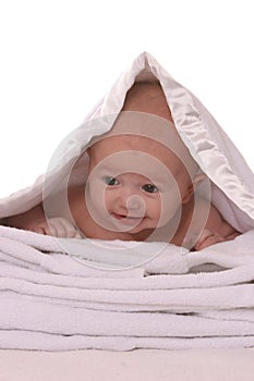 Baby under blanket