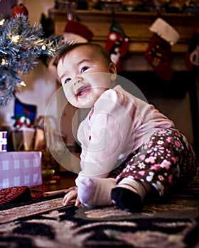 Baby Under Christmas Tree