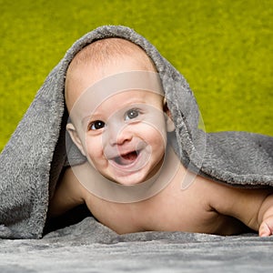 Baby under towel