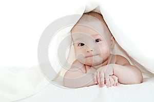 Baby under white blanket