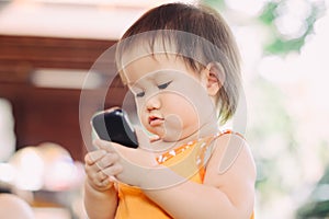 A baby using cell phone