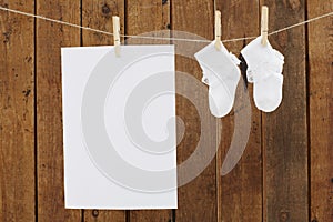 Baby wear hanging in clothespins on washing line