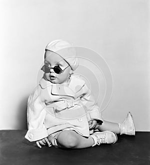 Baby wearing beret and sunglasses