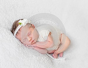 Baby with white hairband, dressed in suit photo