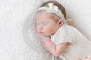 Baby with white hairband, dressed in suit photo