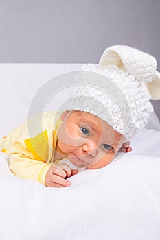 Baby in a white hat