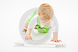 Baby with white keyboard