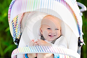 Baby in white stroller