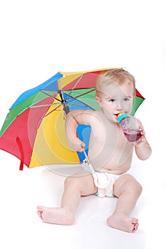 Baby in white with umbrella