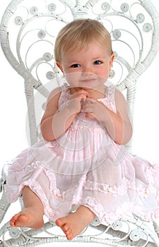 Baby in White Wicker Chair