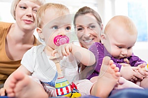 Babys in toddler group playing