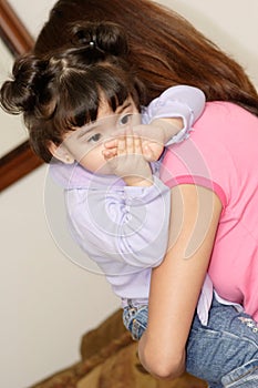Babysitter holding cute baby girl photo