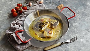 Bacalao al pil pil, salted cod in olive oil sauce, spanish cuisine, basque country photo