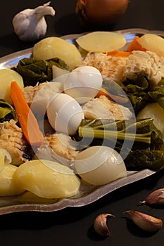 The `Bacalhau Cozido` is a traditional codfish recipe from Minho during the Christmas Eve. photo