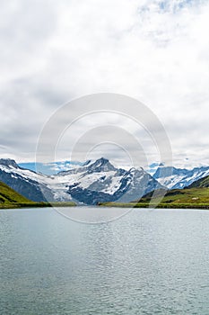 Bachalpsee lake with Schreckhorn and Wetterhorn at Grindelwald in Switzerland