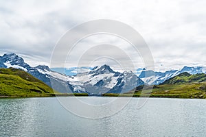 Bachalpsee lake with Schreckhorn and Wetterhorn at Grindelwald in Switzerland