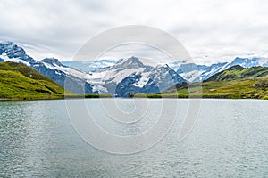 Bachalpsee lake with Schreckhorn and Wetterhorn at Grindelwald in Switzerland