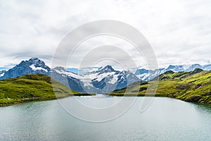 Bachalpsee lake with Schreckhorn and Wetterhorn at Grindelwald in Switzerland