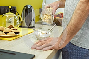 Bachelor man daily routine in the kitchen single lifestyle concept cooking breakfast close-up