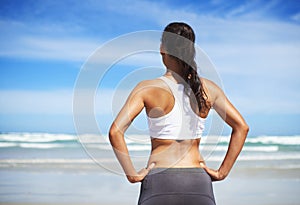 Back, beach and woman with fitness, vacation and training with summer break or sunshine with water. Person, seaside or
