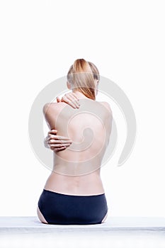 Back of beautiful nude woman on white background