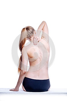 Back of beautiful nude woman on white background