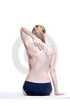 Back of beautiful nude woman on white background