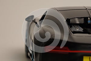 Back of black Bugatti Chiron realistic toy car photo
