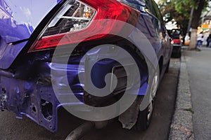 Back of a blue modern car after a crash accident.