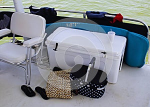 The back of the boat - Chair and cooler and picnic basket and be