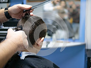 Back of a boy having his hair cut