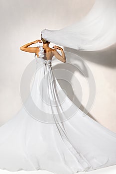 Back of bride in wedding white dress