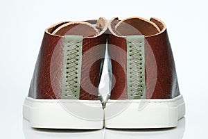 Back of brown leather sneakers