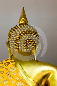 The back of Buddha statue placed on the altar
