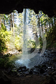Back cave view of Ponytail Falls in the Columbia River Gorge waterfall area of Oregon