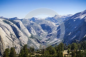 Snow capped mountains and snow melt running down in the valley in Yosemite National Park, California