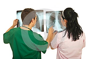Back of doctors checking X-rays