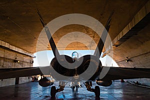 Back of an F18 fighter in the hangar