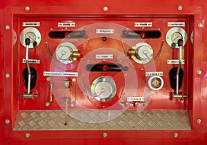 Back of a fire truck . Dials and controls.