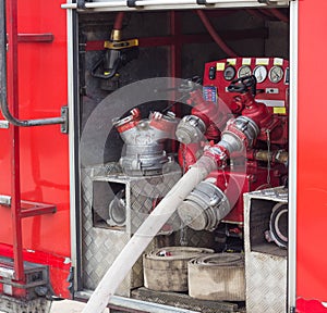 Back of the fire truck, hoses and equipment, red fire engine, special equipment and hydrants