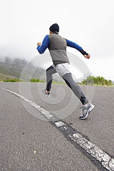 Back, fitness and man running on road in training, cardio exercise or endurance workout for wellness. Sports, runner or